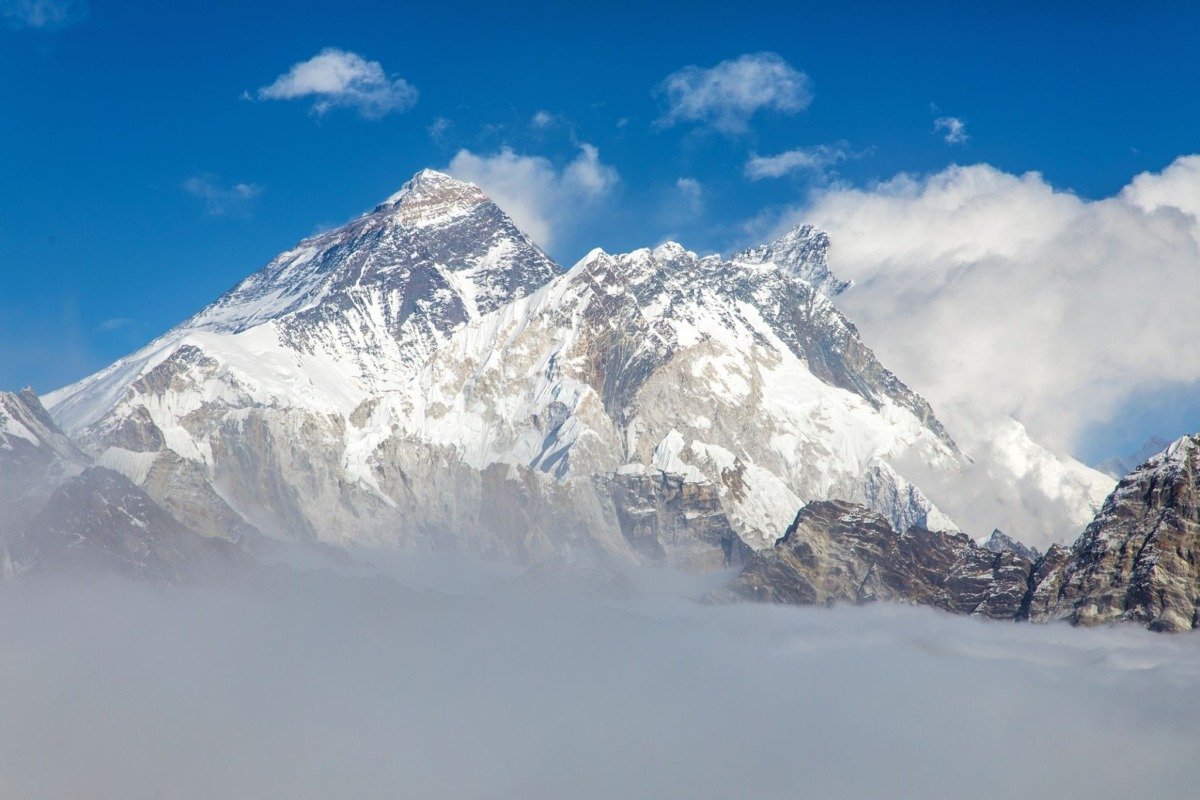 Mount Everest towering above the clouds in the Himalayas